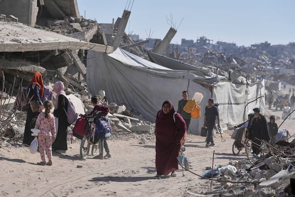 Displaced Palestinians fleeing Beit Lahia amid ongoing Israeli military operations in the Gaza Strip arrive in Jabalia, northern Gaza, on Friday, May 16, 2025. (AP Photo/Jehad Alshrafi)