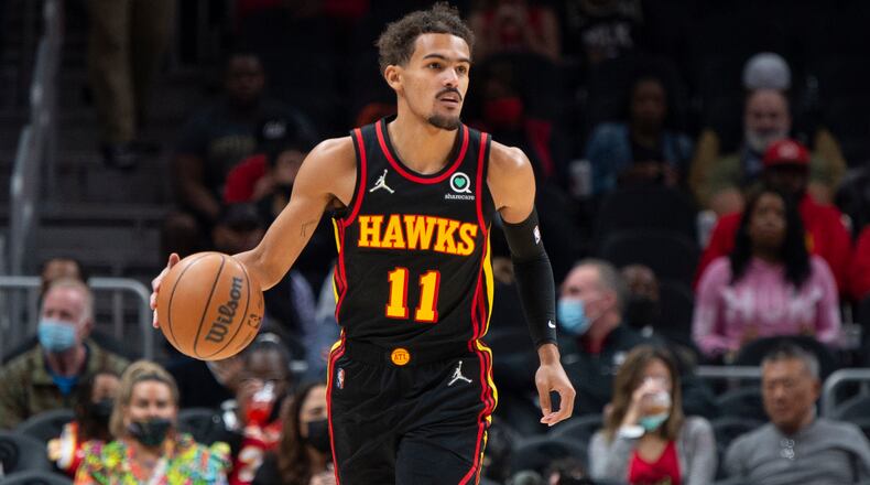Trae Young dribbles up the court during the first half of Monday's Wizards-Hawks game at State Farm Arena in Atlanta. (AP Photo/Hakim Wright Sr.)