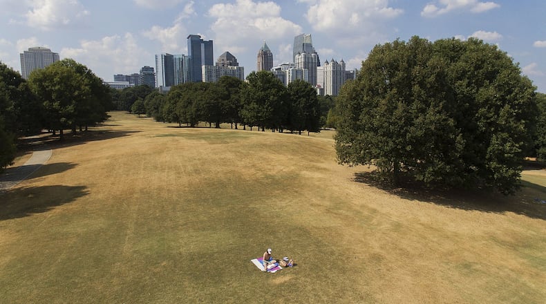 A man sunbathes amid patches of dried-out lawn from a lack of rain in Atlanta on Oct. 3, 2019. Scientists say more than 45 million people across 14 Southern states are now in the midst of a drought that’s cracking farm soil, drying up ponds and raising the risk of wildfires. AP PHOTO / DAVID GOLDMAN