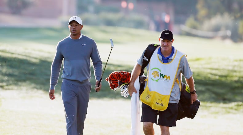 SCOTTSDALE, AZ - JANUARY 28: Tiger Woods walks with his caddie Joe LaCava to a green during the pro-am prior to the start of the Waste Management Phoenix Open at TPC Scottsdale on January 28, 2015 in Scottsdale, Arizona. (Photo by Scott Halleran/Getty Images) Tiger Woods walks with caddie Joe LaCava to a green during Wednesday's pro-am prior to the Phoenix Open. (Getty Images)