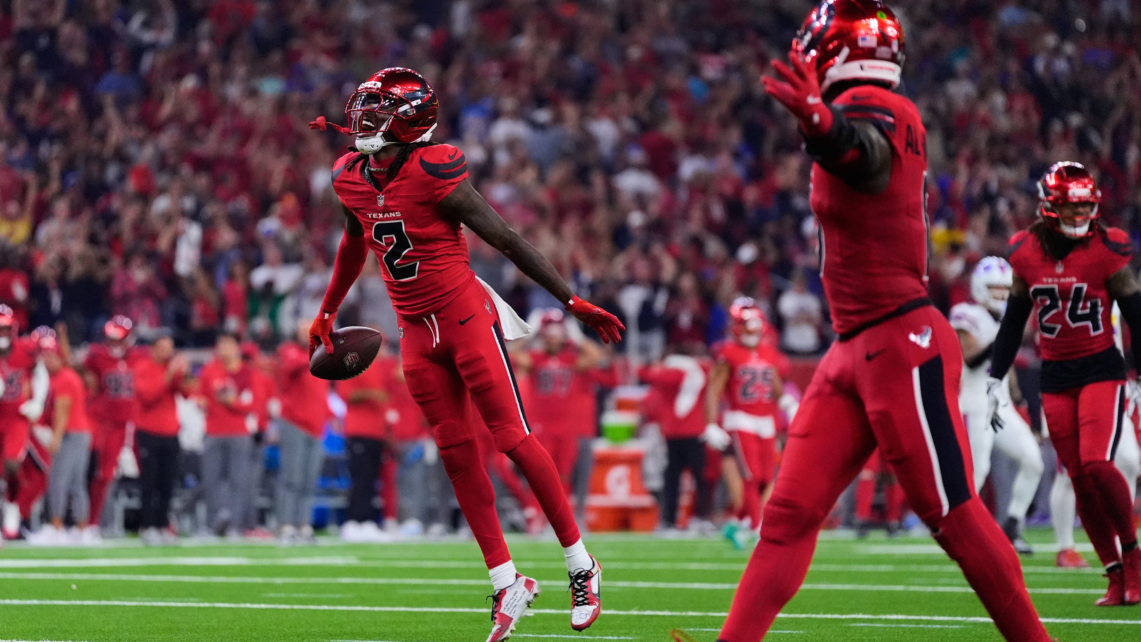 Houston Texans safety Calen Bullock (2) celebrates after intercepting a Buffalo Bills' Josh Allen pass in the second half of an NFL football game Thursday, Nov. 20, 2025, in Houston. (AP Photo/Ashley Landis)