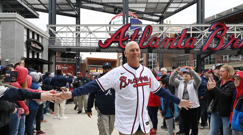 Braves manager Brian Snitker greets fans as he and players walk to Georgia Power Pavilion Stage during Braves Fest Opening Rally at The Battery Atlanta, Saturday, Jan. 21, 2023, in Atlanta. (Hyosub Shin / Hyosub.Shin@ajc.com)