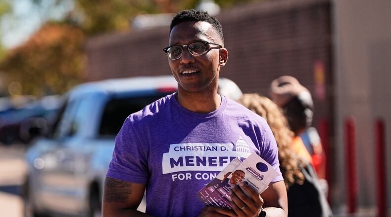 FILE - Democratic 18th Congressional District candidate Christian Menefee greets voters near a polling place on Nov. 4, 2025, in Houston. (AP Photo/Ashley Landis, file)