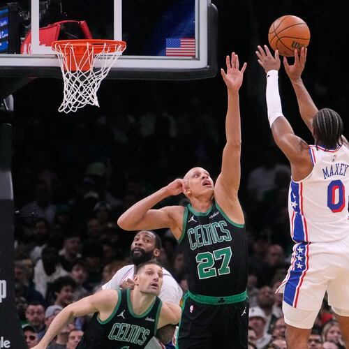 Philadelphia 76ers guard Tyrese Maxey (0) takes a shot over Boston Celtics guard Jordan Walsh (27) during the first half of Game 5 of a first-round NBA playoffs basketball series, Tuesday, April 28, 2026, in Boston. (AP Photo/Charles Krupa)