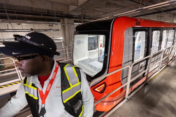 Deputy operational maintenance manager Junior Smikle stands in front of a new Plane Train car at Hartsfield-Jackson Atlanta International Airport Maintenance Facility in Atlanta on Wednesday, May 7, 2025. (Arvin Temkar/AJC)