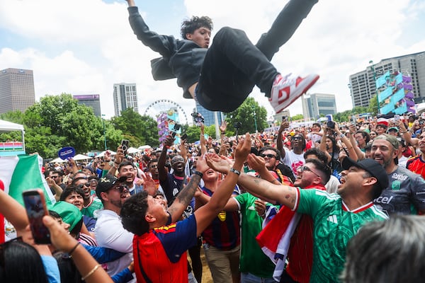A fan at Atlanta’s FIFA Fan Fest gets tossed in the air after Sunday’s match between Spain and Saudi Arabia. (Abbey Cutrer/AJC)