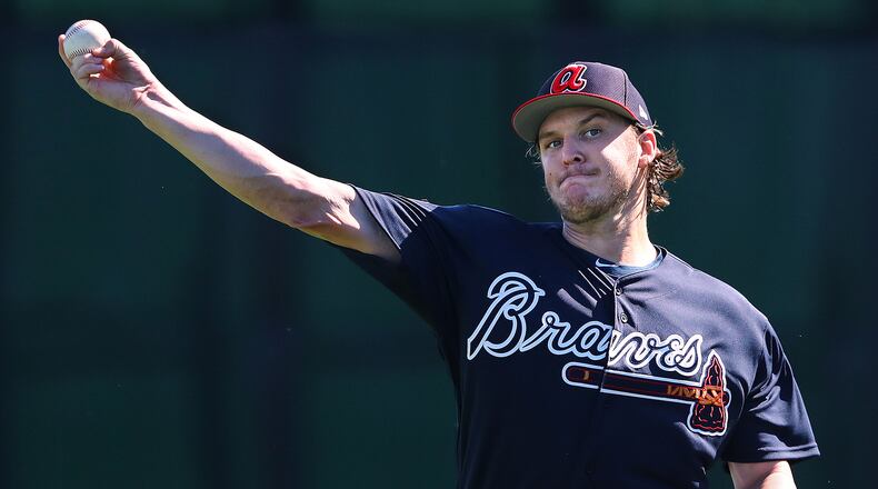 Atlanta Braves pitcher Jacob Webb loosens up his arm throwing in the field during spring training at the ESPN Wide World of Sports Complex on Sunday, Feb. 17, 2019, in Lake Buena Vista.    Curtis Compton/ccompton@ajc.com