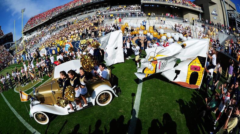 Members of the Georgia Tech Yellow Jackets cheerleaders lead the team onto the field before the game against the Georgia Bulldogs at Bobby Dodd Stadium on November 28, 2015 in Atlanta, Georgia. (Photo by Scott Cunningham/Getty Images)