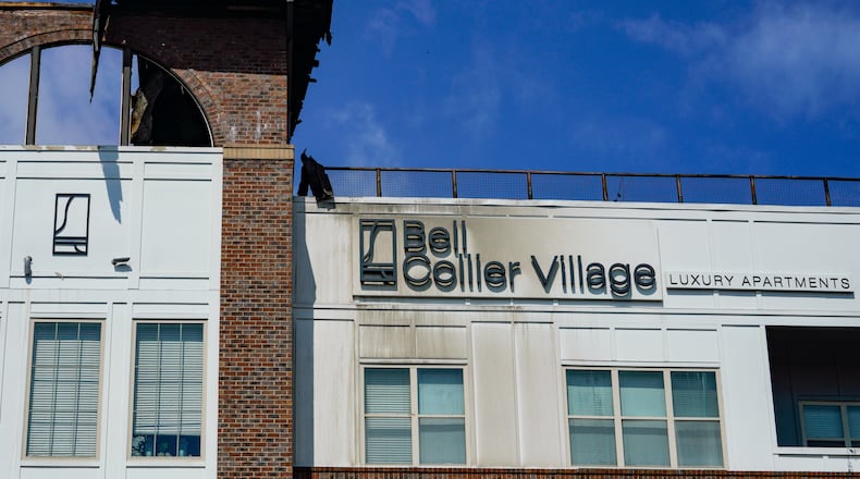 A blaze at the Bell Collier Village apartments happened during a party on the rooftop and may have been caused by a propane grill filled with charcoal, fire officials said.