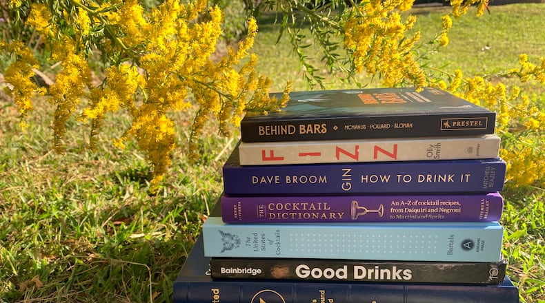 The season's new drink books range from deep dives into single spirits to compilations of recipes. / Angela Hansberger for The Atlanta Journal-Constitution