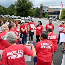 Cobb County community members rally to demand the removal of Superintendent Chris Ragsdale outside Cobb County School District building, Thursday, September 14, 2023, in Marietta. Shortly after this, the district unexpectedly changed its procedures for signing up to speak at a meeting. Two parents are now suing the district for those changes and accusing officials of trying to keep critics from speaking. (Hyosub Shin/AJC)