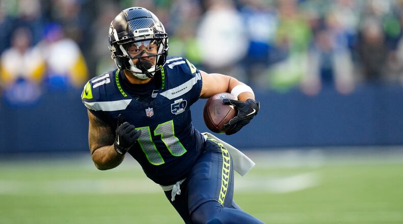 FILE - Seattle Seahawks wide receiver Jaxon Smith-Njigba (11) runs with the ball during the NFC Championship NFL football game Jan. 25, 2026, in Seattle. (AP Photo/Ben VanHouten, File)