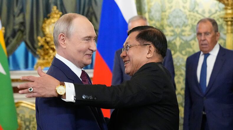 Russian President Vladimir Putin, left, welcomes Myanmar President Min Aung Hlaing during their meeting at the Grand Kremlin Palace, in Moscow, Tuesday, Aug. 18, 2026. (AP Photo/Alexander Zemlianichenko, Pool)