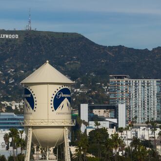 The Paramount Pictures water tower is seen in Los Angeles, Thursday, Dec. 18, 2025, with the Hollywood sign in the distance. (AP Photo/Jae C. Hong)