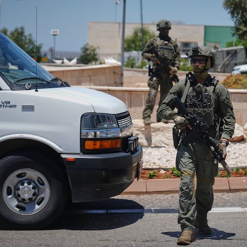 Israeli security forces are deployed at the scene of a shooting attack carried out by a Palestinian citizen of Israel near Tzur Yitzhak in central Israel, Sunday, June 7, 2026. (AP Photo/Ariel Schalit)