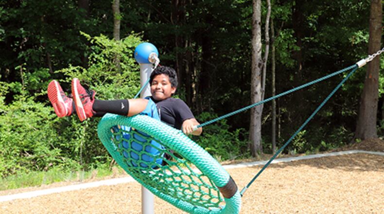A visitor enjoys the new additions to Club Drive Park near Lawrenceville. SPECIAL PHOTO / GWINNETT COUNTY