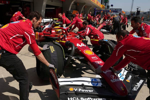Ferrari driver Lewis Hamilton of Britain gets a pit stop during the first free practice at the Shanghai International Circuit in Shanghai, China, Friday, March 21, 2025, ahead of the Chinese Formula One Grand Prix (Sunday). (AP Photo/Andy Wong)