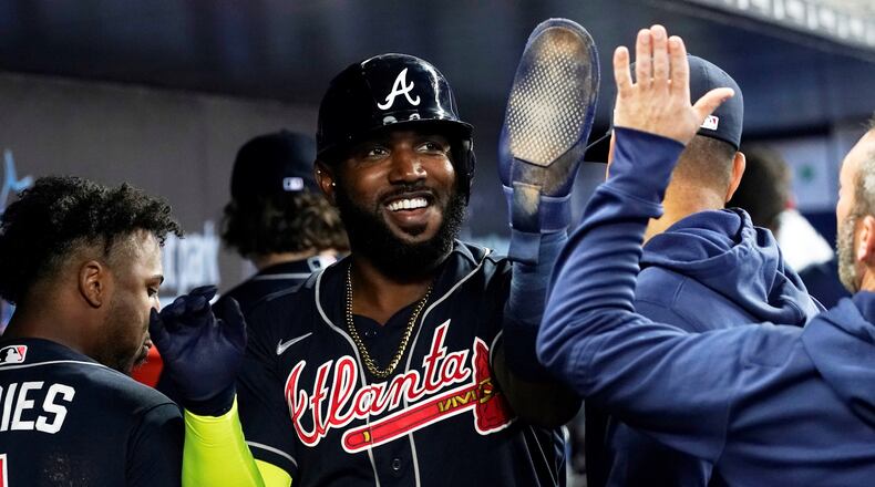 Marcell Ozuna is well-liked in the Atlanta clubhouse, and his Braves teammates had a big celebration for Ozuna Tuesday after he reached a milestone in major-league service.