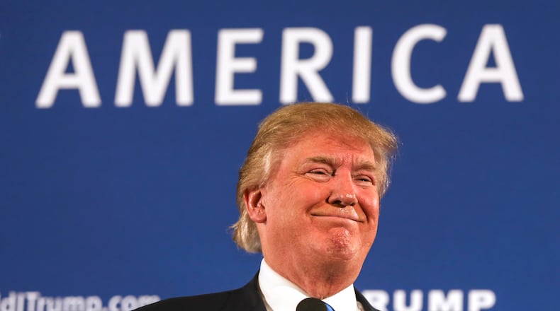 In this Oct. 26 photo, Republican presidential candidate Donald Trump smiles as he receives applause after speaking at a town hall meeting at a country club in Atkinson, N.H. AP/Cheryl Senter