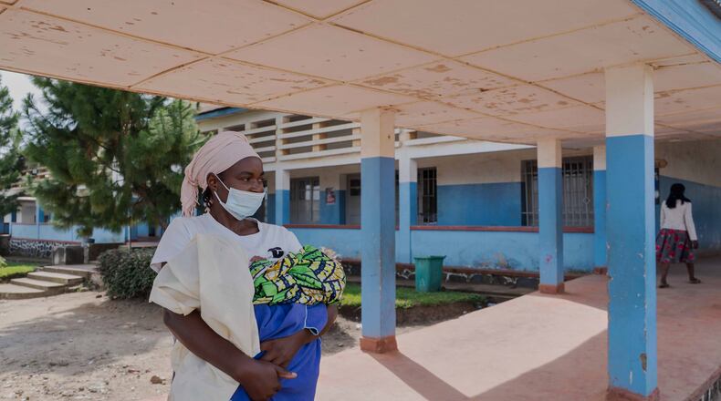 A woman wearing a protective mask stands in the corridor of a hospital in Bunia, Congo, Sunday, May 17, 2026. (AP Photo/ Dirole Lotsima Dieudonne)