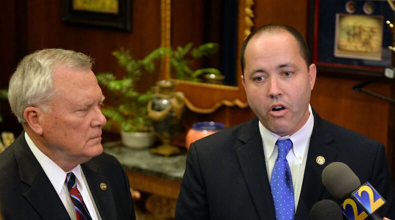Gov. Nathan Deal (left) and Chris Carr, the commissioner of the state’s Department of Economic Development, answer questions following the announcement in January that Mercedes-Benz will be relocating its corporate headquarters for America in Sandy Springs. On Wednesday, Deal named Carr as attorney general. Carr will move into the new position Nov. 1, replacing Sam Olens, who was named Wednesday as the new president at Kennesaw State University. KENT D. JOHNSON/ KDJOHNSON@AJC.COM