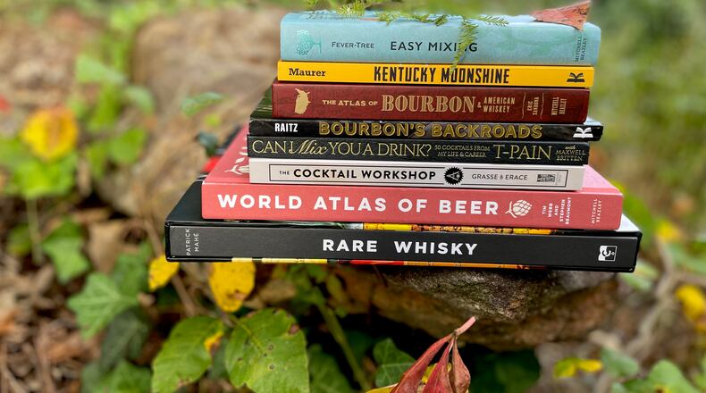 The season's crop of fall drink books includes hefty reference books, satirical recipe manuals and deep dives on specific categories such as Japanese drinking, moonshine and rare whisky. (Angela Hansberger for The Atlanta Journal-Constitution)