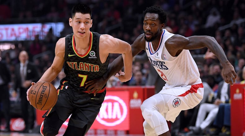 Jeremy Lin of the Atlanta Hawks drives past Patrick Beverley  of the LA Clippers during a 123-118 Hawks win at Staples Center on January 28, 2019 in Los Angeles, California. (Photo by Harry How/Getty Images)