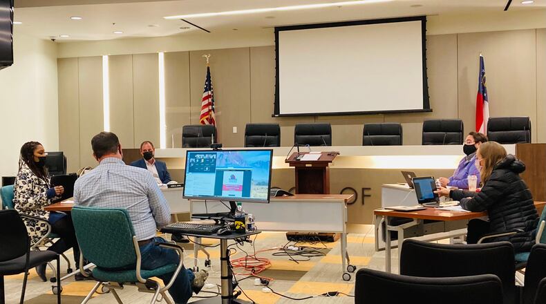 Decatur's school board during a Dec. 3 work session where they discussed a potential return to in-classroom learning. L-R, Superintendent David Dude (back to camera), Tasha White, Chair Lewis Jones, James Herndon and Heather Tell. Jana Johnson-Davis attended virtually. Bill Banks for the AJC
