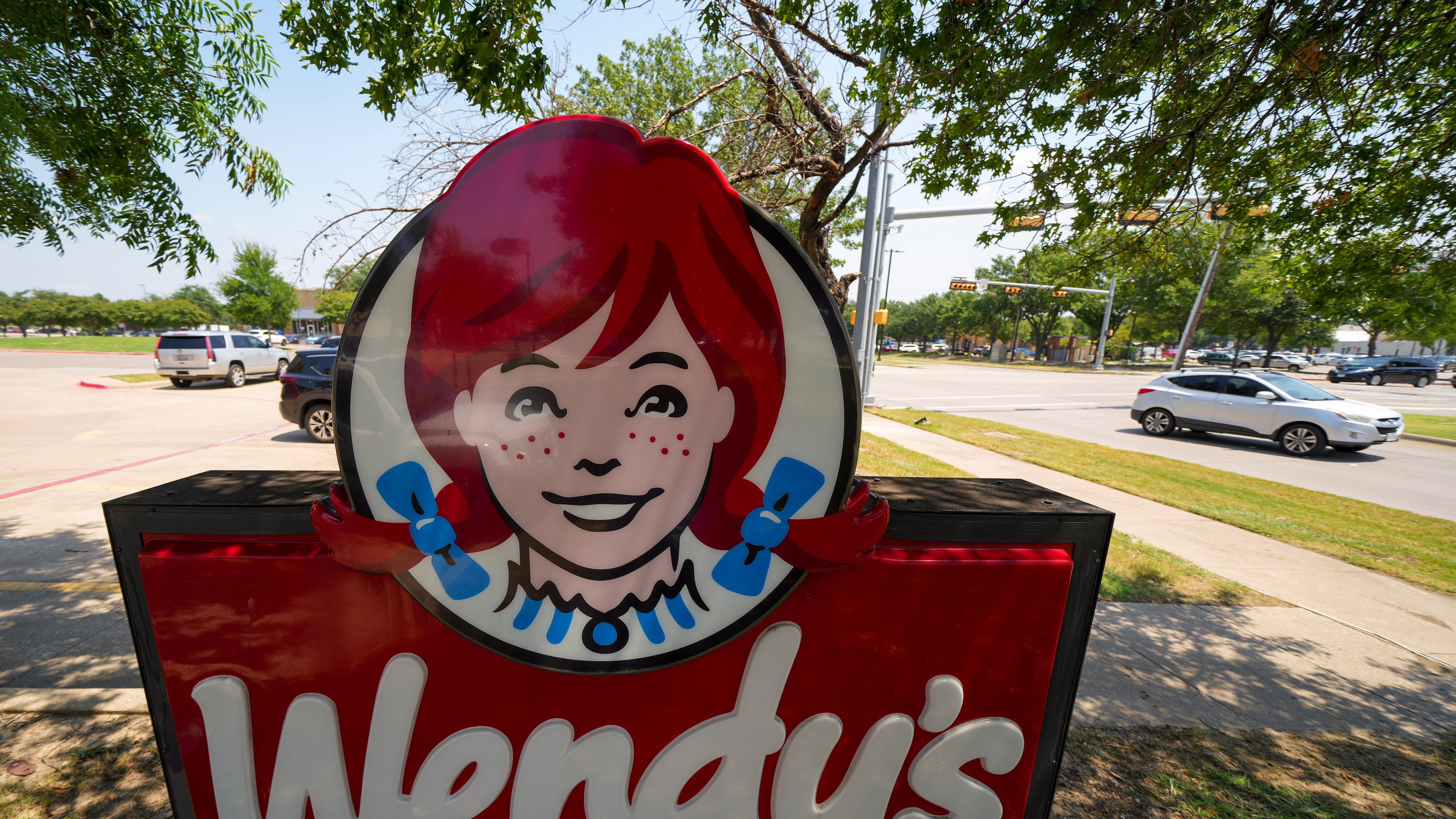 FILE - A sign is seen at a Wendy's restaurant Tuesday, Aug. 5, 2025, in Garland, Texas. (AP Photo/Julio Cortez, File)