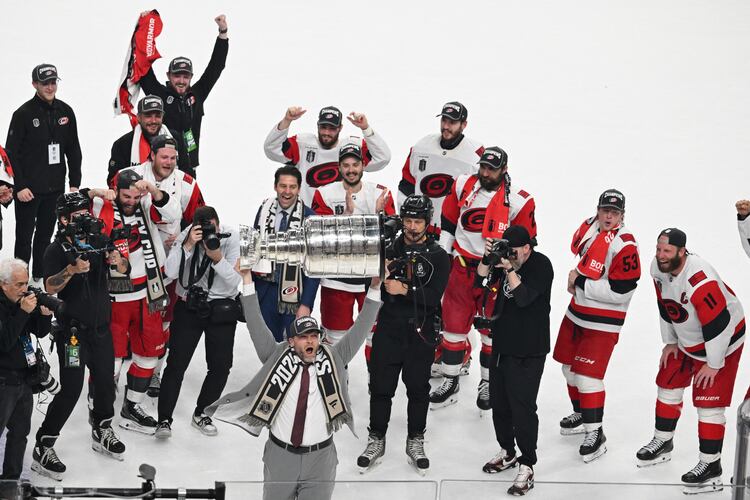 The Carolina Hurricanes celebrates after a win over the Vegas Golden Knights in Game 6 of the NHL hockey Stanley Cup Final series, Sunday, June 14, 2026, in Las Vegas. (AP Photo/Candice Ward)