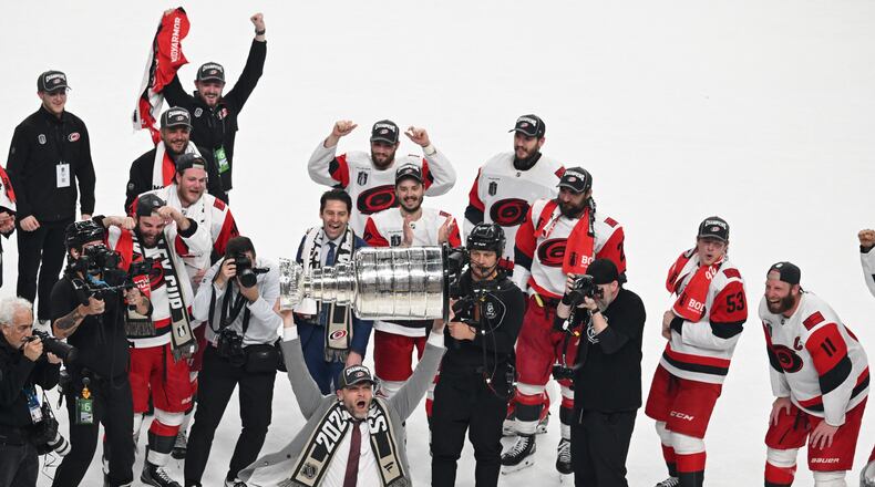 The Carolina Hurricanes celebrates after a win over the Vegas Golden Knights in Game 6 of the NHL hockey Stanley Cup Final series, Sunday, June 14, 2026, in Las Vegas. (AP Photo/Candice Ward)