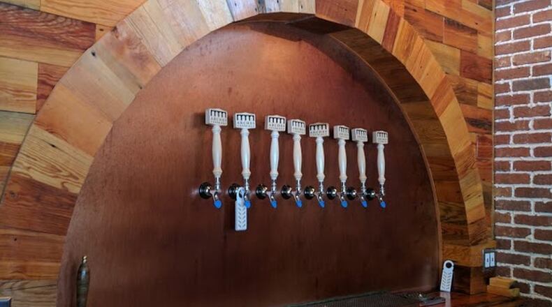 Arches Brewing, a lager-focused brewery that opened in Hapeville in 2016, has a tasting room, as well as a casual beer garden out back. CONTRIBUTED BY PAULA PONTES