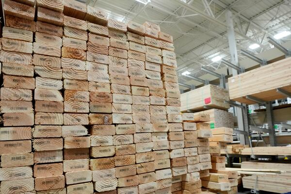Stacks of lumber are set up on shelves at a local Lowes store Tuesday, April 1, 2025, in Tempe, Ariz. (AP Photo/Ross D. Franklin)