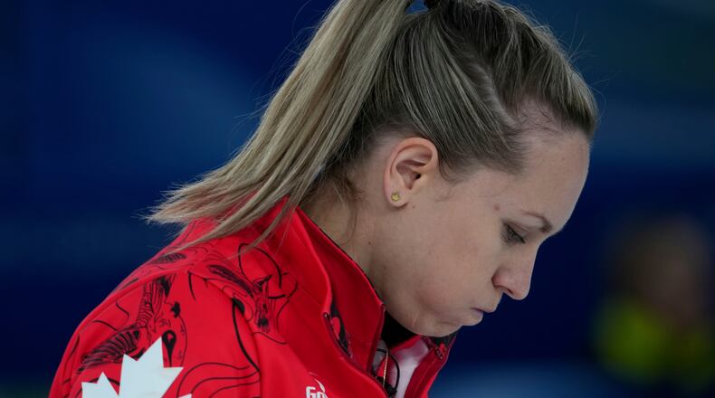 Canada's Rachel Homan reacts during a women's curling semifinal match against Sweden, at the 2026 Winter Olympics, in Cortina d'Ampezzo, Italy, Friday, Feb. 20, 2026. (AP Photo/Misper Apawu)