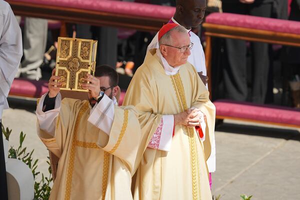 Vatican Secretary of State, Cardinal Pietro Parolin presides over a mass on the second of nine days of mourning for late Pope Francis in St. Peter's Square, at the Vatican, Sunday, April 27, 2025. (AP Photo/Andreea Alexandru)