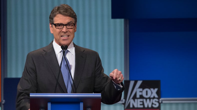 Republican presidential candidate and former Texas Gov. Rick Perry participates a pre-debate forum at the Quicken Loans Arena, Thursday, Aug. 6, 2015, in Cleveland. Seven of the candidates have not qualified for the primetime debate. (AP Photo/John Minchillo)