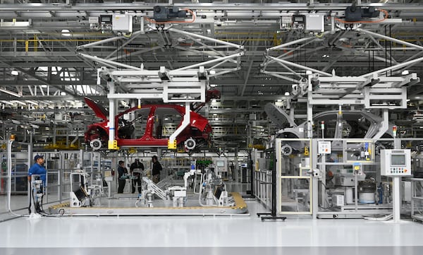 Hyundai Ioniq 5 electric vehicles advance to the next stage of the assembly line at the automaker’s Metaplant in Ellabell. If Hyundai expands the production goal to 800,000 vehicles each year, it would become America’s largest vehicle assembly operation by capacity. (Hyosub Shin/AJC)