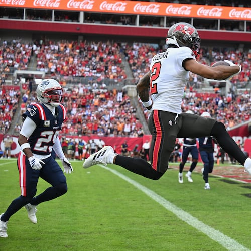 Tampa Bay Buccaneers wide receiver Emeka Egbuka scores a touchdown against the New England Patriots during the first half of an NFL football game Sunday, Nov. 9, 2025, in Tampa, Fla. (Jason Behnken/AP)