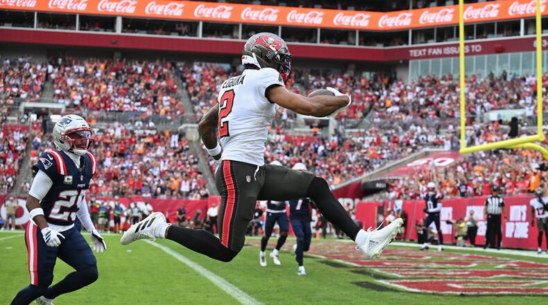 Tampa Bay Buccaneers wide receiver Emeka Egbuka scores a touchdown against the New England Patriots during the first half of an NFL football game Sunday, Nov. 9, 2025, in Tampa, Fla. (Jason Behnken/AP)