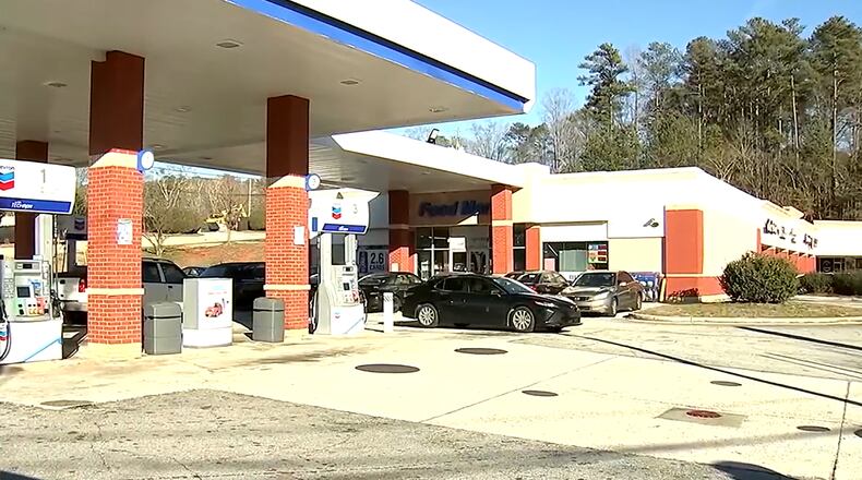 A suspect was arrested after a store clerk was beaten to death inside a DeKalb County gas station Tuesday, police said.