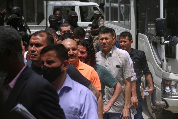 Colombians and Haitians accused of involvement in the 2021 assassination of Haitian President Jovenel Moise arrive to court in Port-au-Prince, Haiti, Monday, June 9, 2025.(AP Photo/Odelyn Joseph)