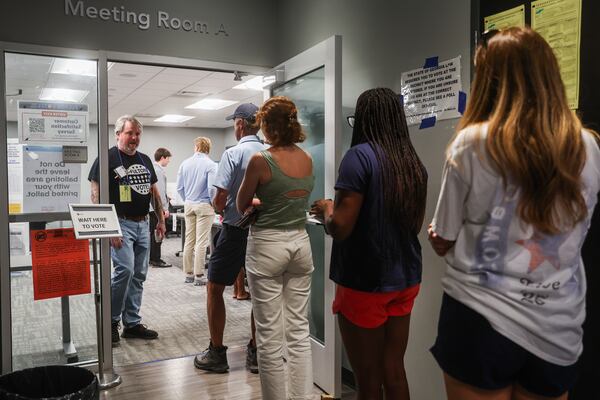 People wait in line to vote at Buckhead Library on election day in Atlanta on Tuesday. (Abbey Cutrer/AJC)