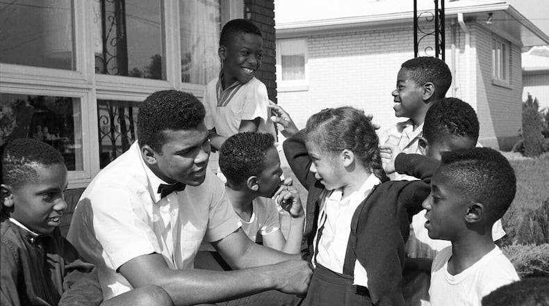 "Ali With Lonnie, Muhammad Ali (Cassius Clay) and Yolanda Williams, Kentucky," (1963) captures a young Cassius Clay and his future wife Lonnie at age 6.
Courtesy of Jackson Fine Art