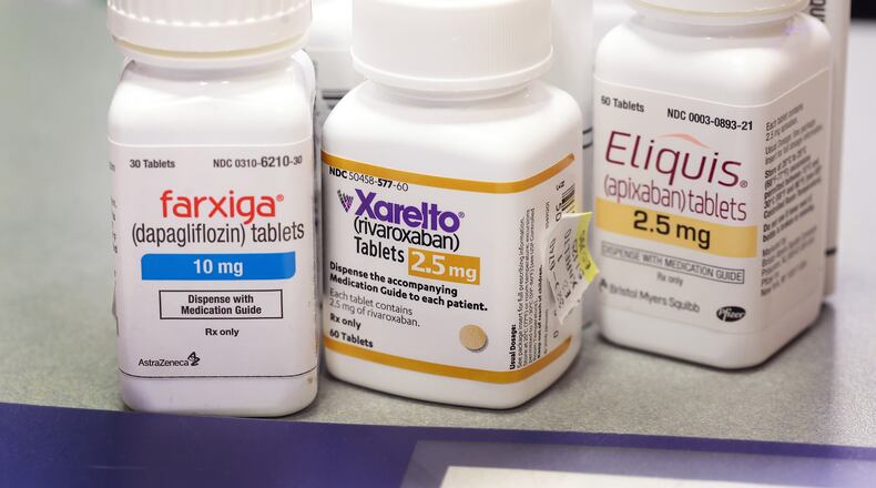 Farxiga, Xarelto, and Eliquis at the New City Halsted Pharmacy on Aug. 29 in Chicago. These are three of 10 prescription drugs that will be subject to Medicare price negotiations under the Inflation Reduction Act. (Photo Illustration by Scott Olson/Getty Images/TNS)