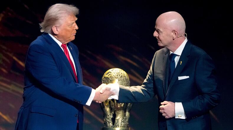 FILE - FIFA President Gianni Infantino, right, awards President Donald Trump with the FIFA Peace Prize during the draw for the 2026 soccer World Cup at the Kennedy Center in Washington, Dec. 5, 2025. (AP Photo/Chris Carlson, File)