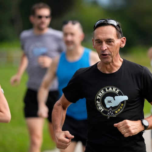 Paul Grinvalds, of West Des Moines, Iowa, runs with the Raccoon River Running Club, Sunday, Aug. 9, 2026, in West Des Moines, Iowa. (AP Photo/Charlie Neibergall)