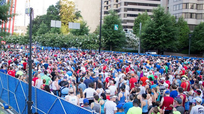 People line up to run in the annual AJC Peachtree Road Race on Wednesday, July 4, 2018. Jenna Eason / Jenna.Eason@coxinc.com