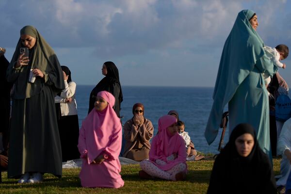 Muslim worshippers gather for Eid al-Fitr prayer in the mixed Arab Jewish city of Jaffa, near Tel Aviv, Israel, Sunday, March 30, 2025. (AP Photo/Ohad Zwigenberg)