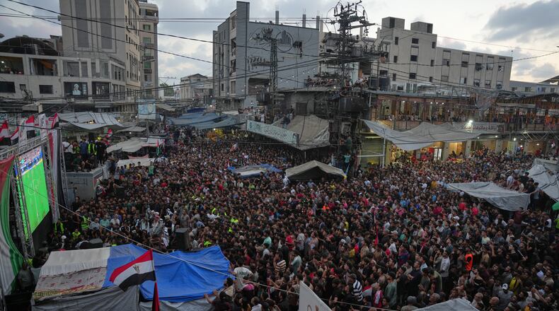 Palestinians watch a live broadcast of the World Cup round of 16 soccer match between Argentina and Egypt in Nuseirat, central Gaza Strip, Tuesday, July 7, 2026. (AP Photo/Abdel Kareem Hana)