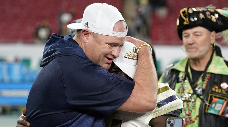 Georgia Tech coach Brent Key hugs Jamal Haynes after the Yellow Jackets' 30-17 victory over Central Florida on Friday.